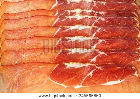 Thinly Sliced German Black Forest Ham With Sliced Ciabatta Bread. Sliced And Smoked Ham With Schwarz