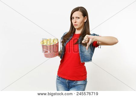 Portrait Of Young Dissatisfied Attractive Brunette Woman In Casual Clothes Watching Movie Film, Hold