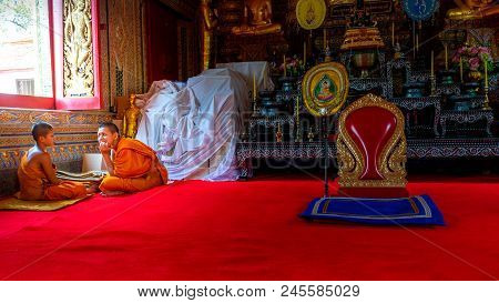 Songkhla, Thailand Apr. 13, 2018 : Two Unknown Young Novice Monks Sit In The Church At Wat Rat Pradi