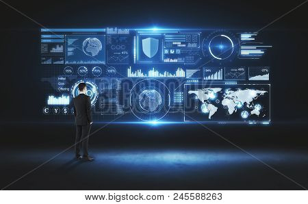 Back View Of Young Businessman Looking At Glowing Digital Business Interface. Innovation And Future 