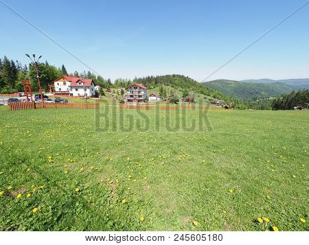 House At Green Landscapes Of Grassy Terrain And Forest At Beskid Mountains Range In European Salmopo