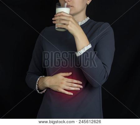 The Girl Holds On To The Stomach And Drinks Milk, Pain And Burning In The Stomach, Heartburn, Stomac