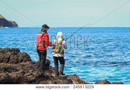 Two Fisherman On Cape Schank, Victoria, Australia.