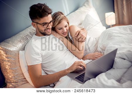 Beatiful Lovers Relaxing Lying On Their Bed