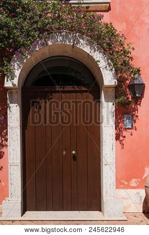 Beautiful Door Decorated With Flowers In Italian Farm House