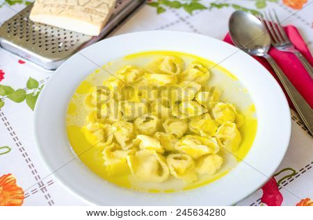 Traditional Italian Homemade Tortellini In Broth Soup. Real Italian Dinner In Countryside. Italian F