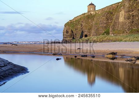 A Reflective View Of The Mussenden Temple At Downhill
