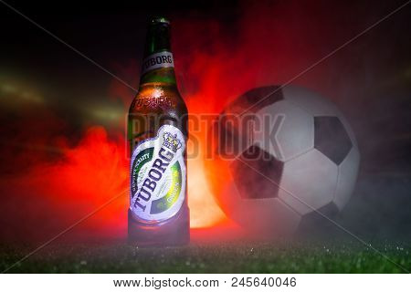 Baku,azerbaijan - June 15, 2018 : Creative Concept. Tuborg Glass Bottle Beer On Grass With Soccer Ba