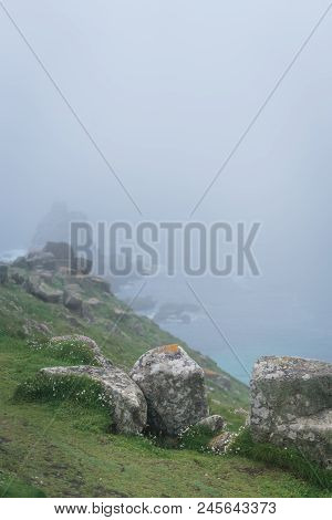 Large Boulders On The Coast Of The Lands End - The Most Westerly Point Of England Which Is A Popular