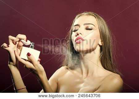 Girl Advertises Perfume. Portrait Of One Beautiful Young Sensual Woman With Long Hair Bright Make-up