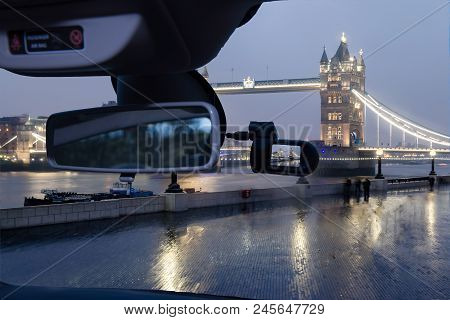 Looking Through A Dashcam Car Camera Installed On A Windshield With View Of Tower Bridge At Night, I