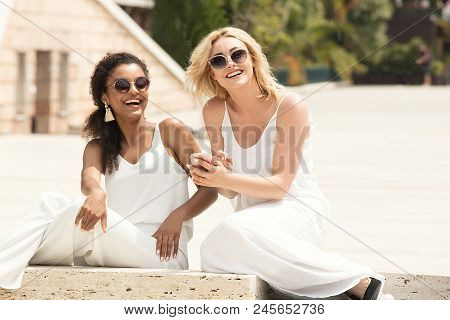 Two Multiracial Girlfriends Having Fun Together.