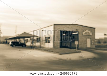 Vintage Blurred Conveyor Car Wash Station In Texas, Us