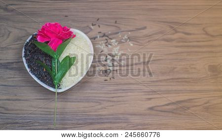 On Selective Focus Of On Seletive Focus Of Heart-shaped Cup That Put Rice Berry & Flowers Pink Paste