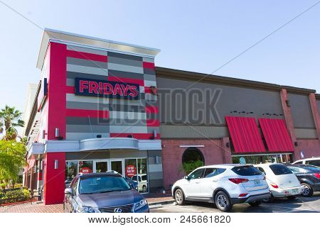 Orlando, Usa - May 8, 2018: Tgi Fridays Exterior And Logo. Tgi Fridays Is An American Restaurant Cha
