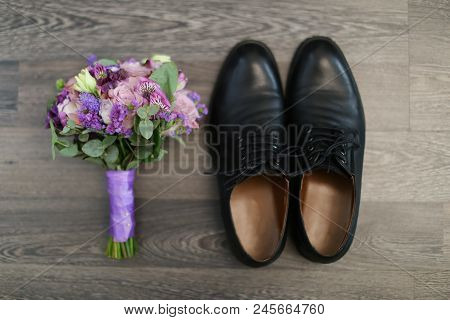 Bouquet Of Flowers And Male Shoes. Concept Of Wedding Composition And Photo Session.