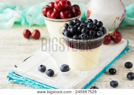 Italian Dessert Pana Cota With Berry Jam And Fresh Blueberries