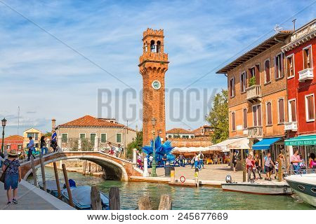 Murano, Italy - September, 2017: Murano, Italy In The Summer Season. Bridge With Canal And Murano Ca
