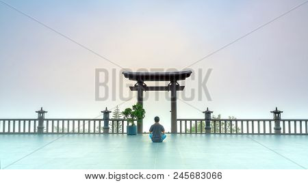 Bao Loc, Vietnam - May 15th, 2018: The Man Meditating In Front Temple As A Way To Relax Soul Into Re
