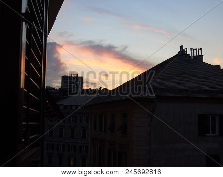 An Amazing Sunset Over The City Of Genova In Spring Days With Some Clouds And Great Reflection Over 