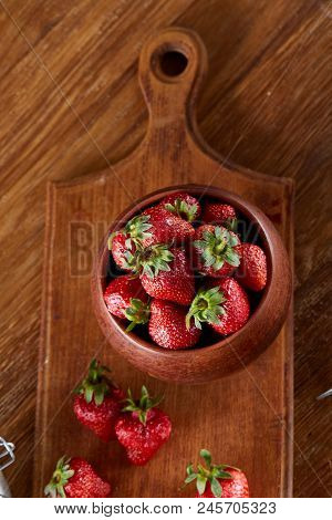 Fresh Strawberries For Cooking Cake In Wooden Bowl Over Rustic Background, Top View, Selective Focus