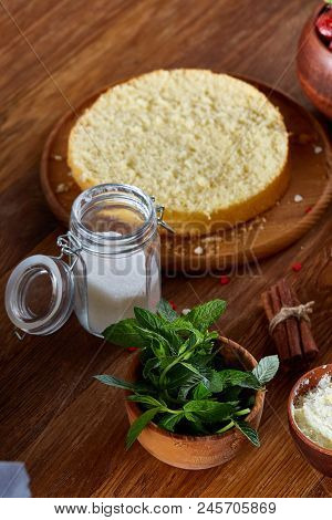 Top View Raw Ingredients For Cooking Strawberry Pie Or Cake On Wooden Table: Eggs, Sugar And Strawbe