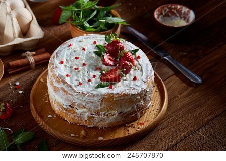 Strawberry Tart Covered With Whipped Sour Cream On A Wooden Tray Over Rustic Background, Close-up, S