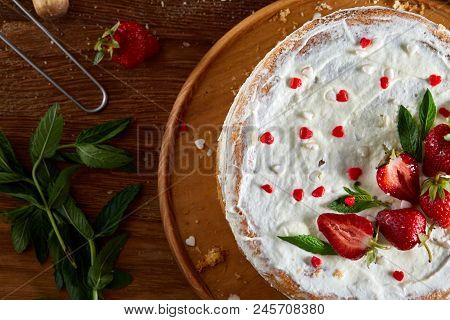 Strawberry Tart Covered With Whipped Sour Cream On A Wooden Tray Over Rustic Background, Close-up, S