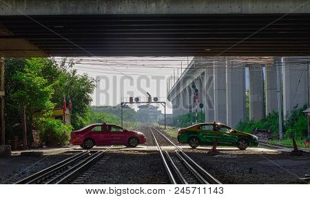 Bangkok, Thailand - Apr 20, 2018. Taxis Running Across Railtracks At Lat Krabang Station In Bangkok,