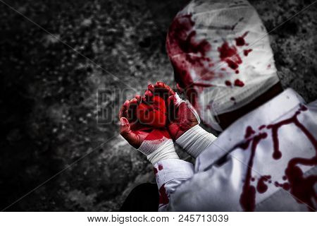 Seriously Injured Man In Body Wraps Bandages Bleeding In Frustrated Depression From Unrequited Love.