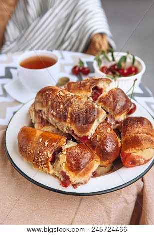 Homemade Baked Croissant With Fresh Garden Cherries