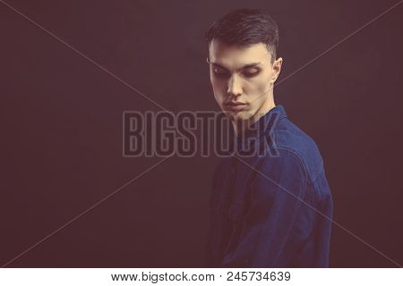 Close Up Portrait Of Good-looking Serious Man With Healthy Clean Skin Posing Isolated Against Black 