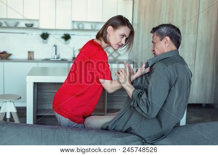 Angry Wife. Furious Stressed Wife Wearing Stylish Red Blouse Feeling Extremely Angry While Looking A