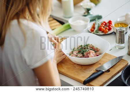 Home Cozy Kitchen Chef Female Making Pickled Turkey Meat With Rosemary Leaves. Barbecue Concept Or H