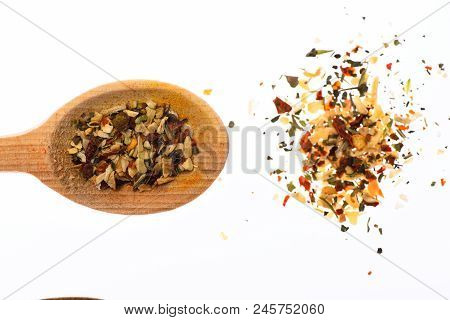 Spoon Filled With Mix Of Kitchen Herbs. Condiments And Spices Concept. Spoon Full Of Mix Of Kitchen 