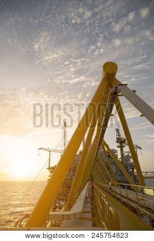 Offshore Construction Platform For Production Oil And Gas. Oil And Gas Industry And Hard Work. Produ