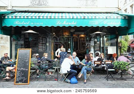 Paris, France-june 16, 2018 : View Of Typical French Bistrot Le Marche In The Quarter Marais, The Hi
