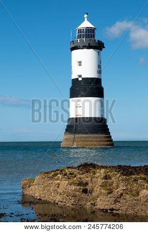 Trwyn Du Lighthouse Is A Lighthouse Between Black Point Near Penmon And Ynys Seriol, Or Puffin Islan