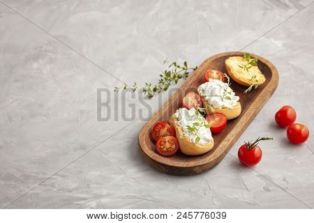 Italian Appetizer Toasted Bread Bruschetta With Cream Chease And Tomatoes. Delicious And Healthy Mea