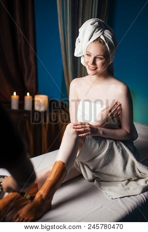 Beautiful Caucasian Woman Getting Body Clay Mask After Massage Treatment With Happy Mood On Vacation