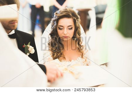 Wedding Couple Bide And Groom Get Married In A Church.