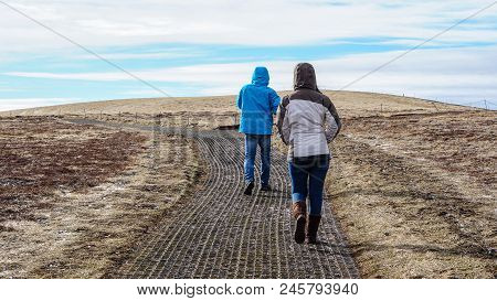 Tourists Walk To Fjord, Iceland Pennisula Bay