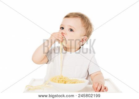 Little Boy In Highchair Eating Spaghetti By Hand Isolated On White Background