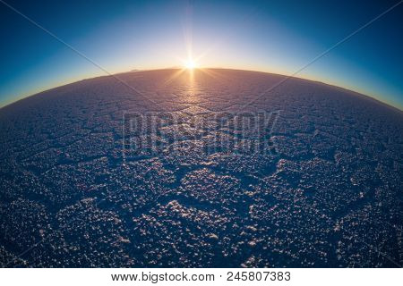 Salar de Uyuni at sunrise. Salt flat of the Salar de Uyuni during sunrise, Bolivia