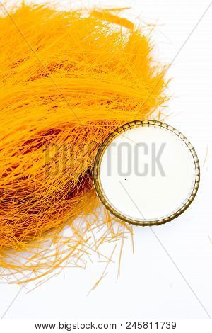 Close Up Of Raw Vermicelli Or Sevee Or Seviyan Or Seviyaan Isolated On White With A Bowl Of Milk Use