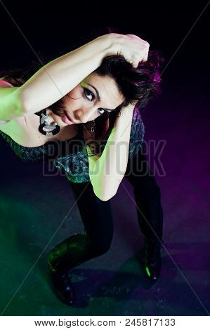 Young Caucasian Brunette Dancing. Top View. Studio Shot