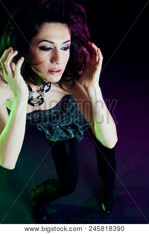 Young Caucasian Brunette Dancing. Top View. Studio Shot