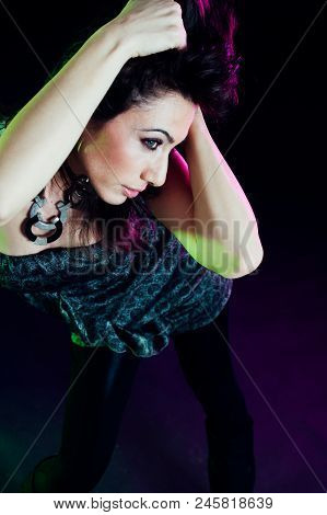 Young Caucasian Brunette Dancing. Top View. Studio Shot