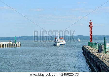 KRYNICA MORSKA - MAY 28: A cruise ship enters the port on the Vistula Spit on 28 May 2018 in Krynica Morska, Poland.