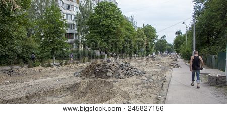 There Are Many Potholes On The Roadway Close-up